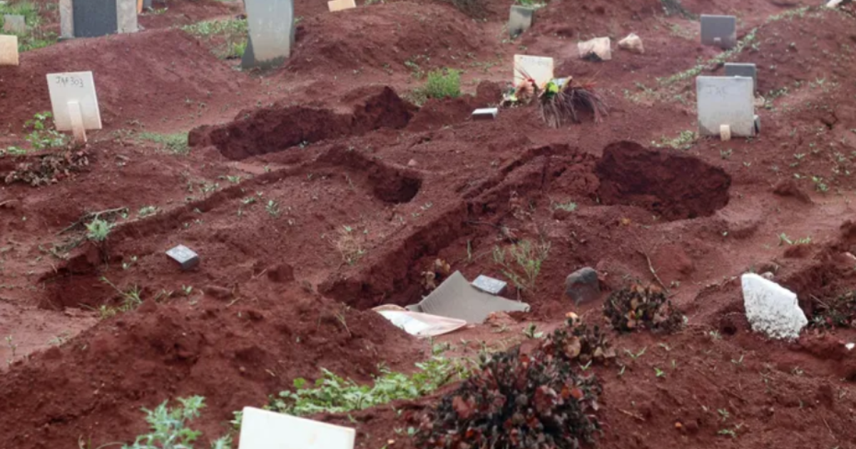 Sunken grave in South African cemetery after flooding